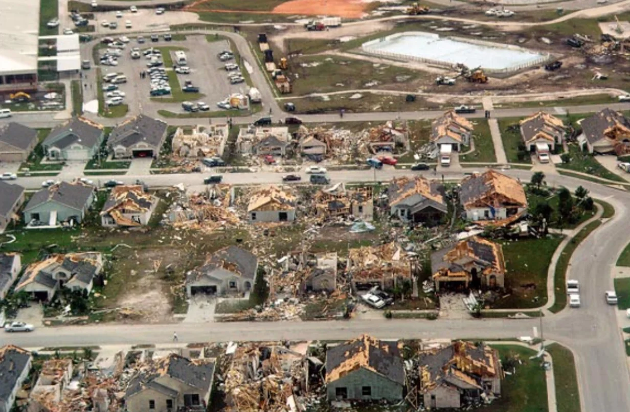 Aerial view of damage to homes in Lakeside subdivision in Kissimmee, Florida. The tornado moved from the upper right to the lower left, narrowly missing a school. Photograph courtesy of Robert Sheets