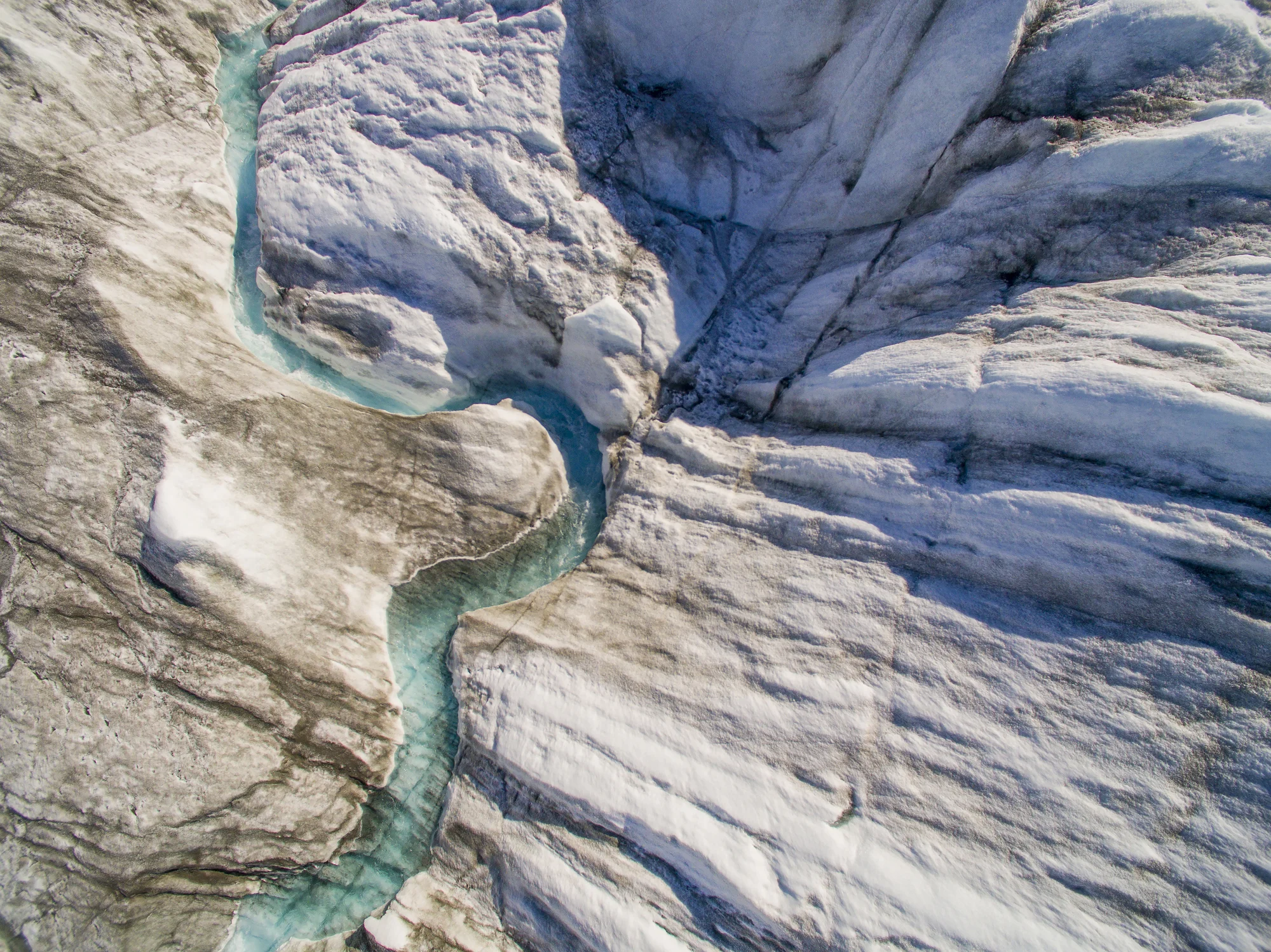 Aerial view of meltwater stream flowing on the surface of the Greenland Ice Sheet. (Paul Souders/ Photodisc/ Getty Images)