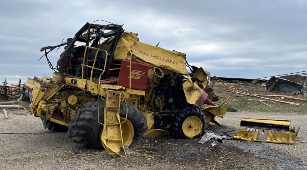 CBC: This 10,000-kilogram combine was lifted by the tornado and tossed about 50 metres, the damage survey team said. (Northern Tornadoes Project)