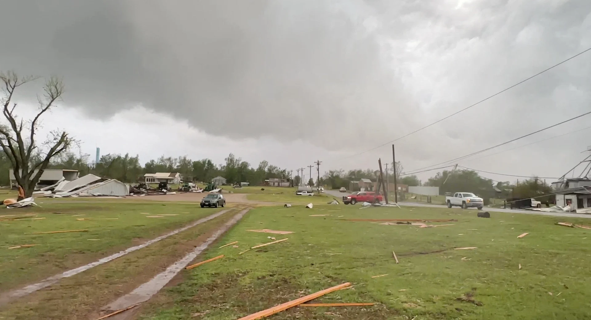 REUTERS: A general view shows damage during a rain-wrapped tornado in Cole, Oklahoma, U.S., April 19, 2023, in this screen grab obtained from a social media video. Hans Duran/via REUTERS