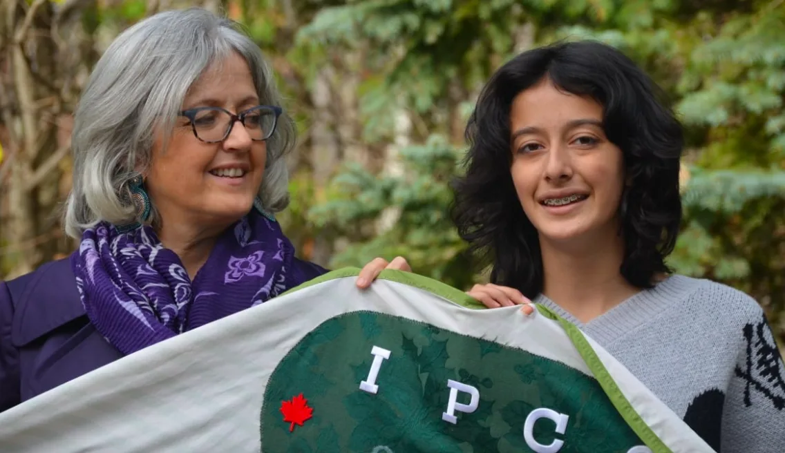 Lead plantiff Sophia Mathur, right, with her mother Cathy Orlando. Mathur is a longtime climate activist and says she's excited to see this case get to a hearing. (Erik White/CBC)