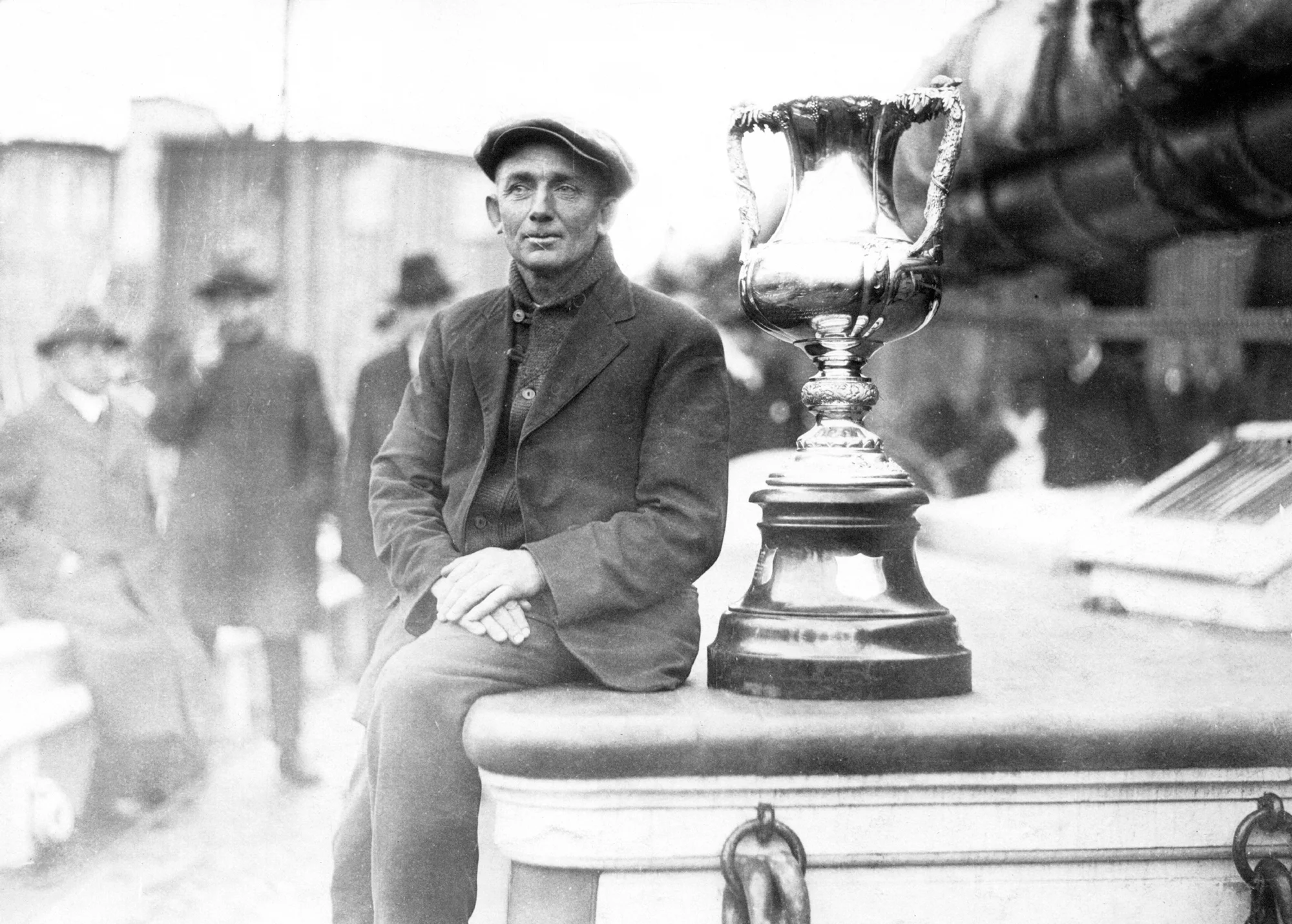 Bluenose - RCM - Captain Angus Walters with the International Fishermen’s Trophy on the deck of the Bluenose, 1921