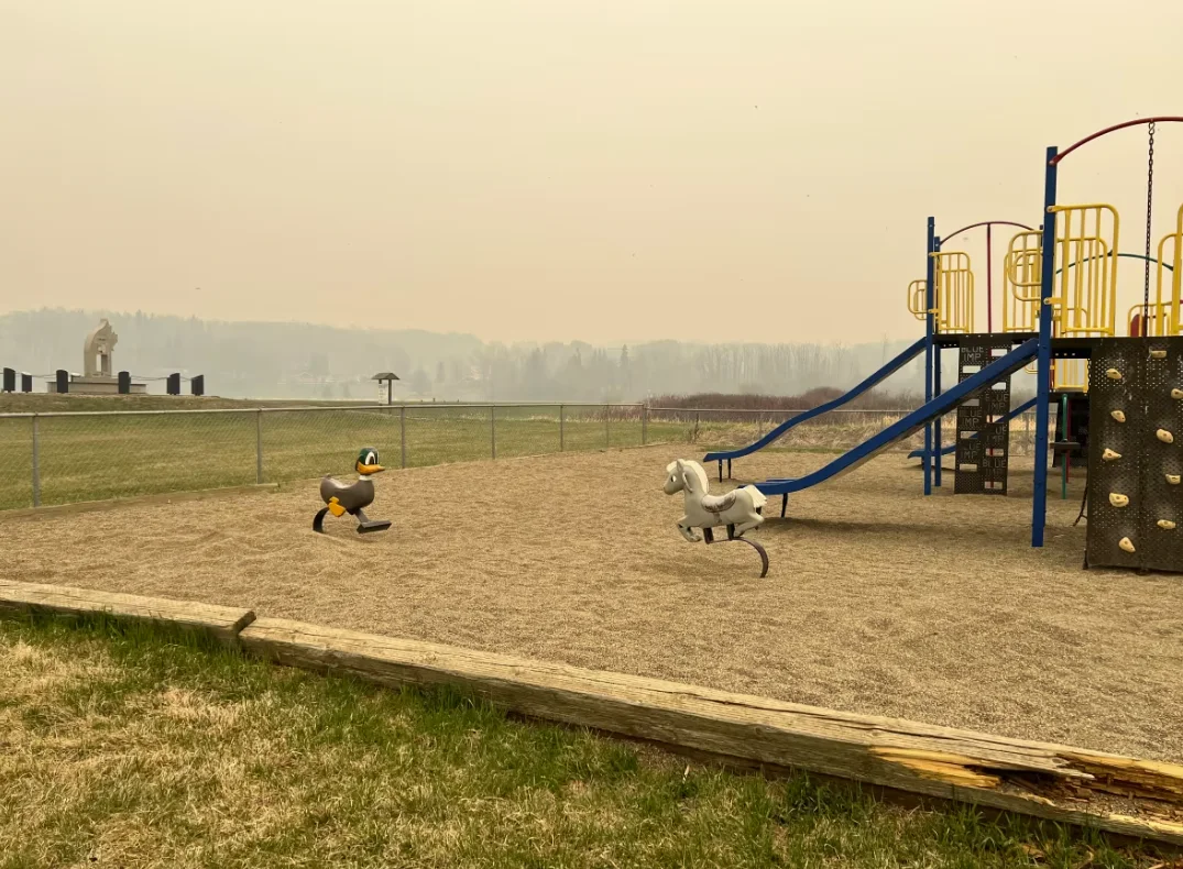 CBC: A playground in Fort St. John is blanketed by smoke on Saturday, the day evacuees headed to the community to escape a wildfire near Fort Nelson. (Yvette Brend/CBC)