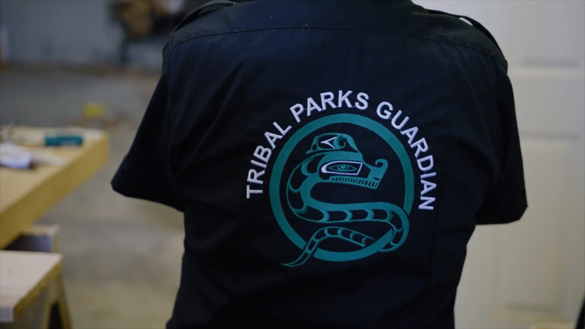 The back of Masso’s shirt displays the logo for the Tribal Parks Guardianship program. (Power to the People)