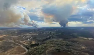 Cool weather, rain to aid in fight against fire threatening Fort McMurray
