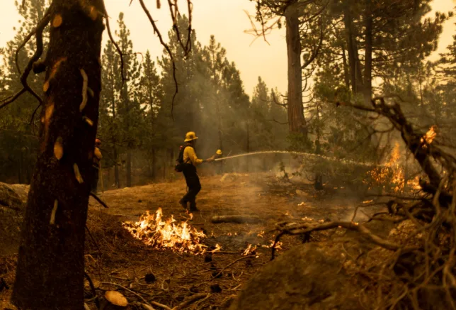 Crews save California town near Lake Tahoe; wildfire rages on
