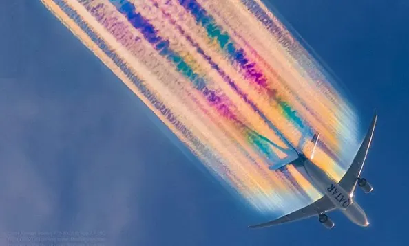 Photographer captures airplane with a technicolour trail