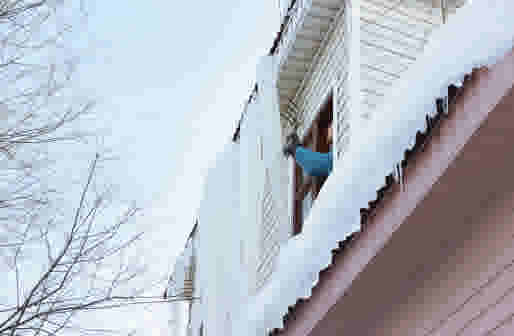 GETTY: Seasonal Icicles Removal After Extreme Weather Events - stock photo. Credit: Palana997