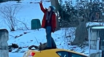 Unfazed woman takes selfie while her car sinks through ice