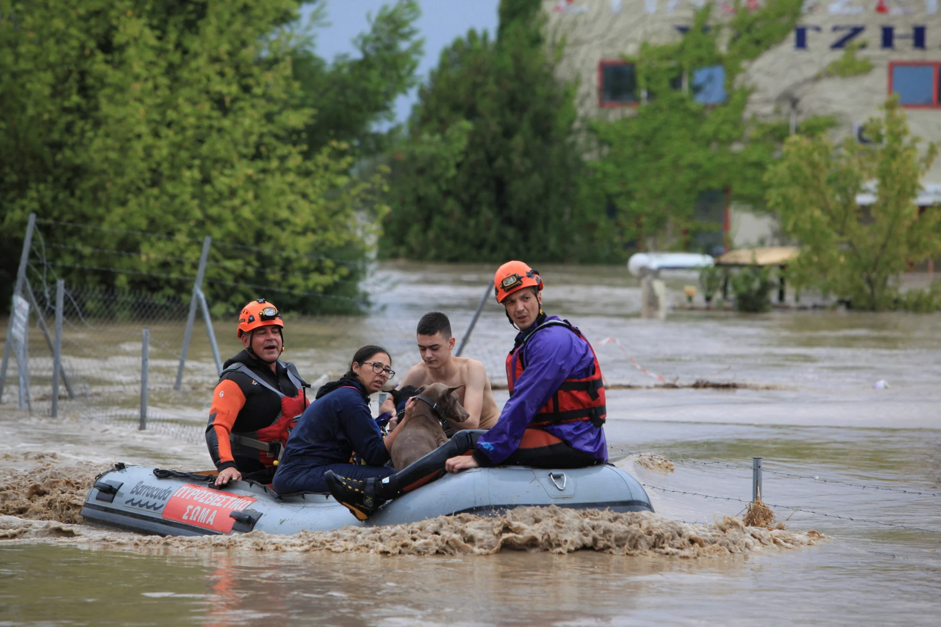 REUTERS: People and dogs are rescued by firefighters from an area flooded due to the impact of storm "Daniel" in the city of Larissa, Greece, September 6, 2023. REUTERS/Kostas Mantziaris