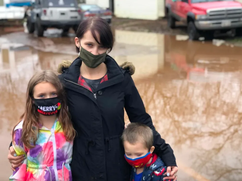 Kelsey Richardson, here with daughter Abby, 8, and son Bentley, 4, was forced to leave her home early Wednesday as water started to get in. (Gary Moore/CBC)