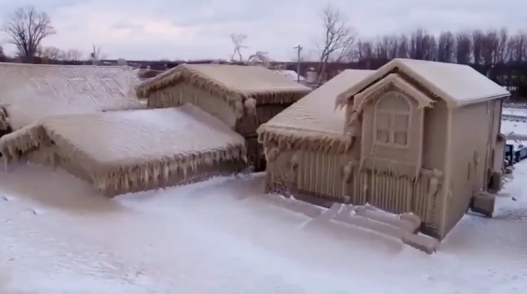 Residents brace for big melt after their homes encased in ice