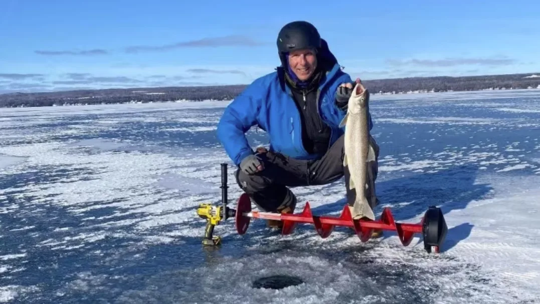 CBC: Julian Holenstein, of Thunder Bay, Ont., with a lake trout he caught Jan, 12,2023, on Lake Superior. (Supplied by Julian Holenstein)