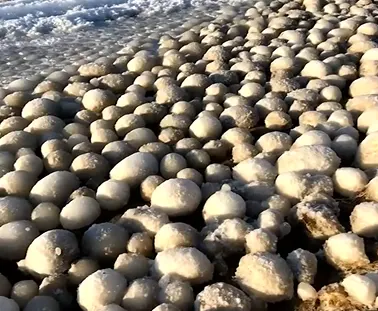 Thousands of bizarre ‘ice balls’ cover beach in Finland