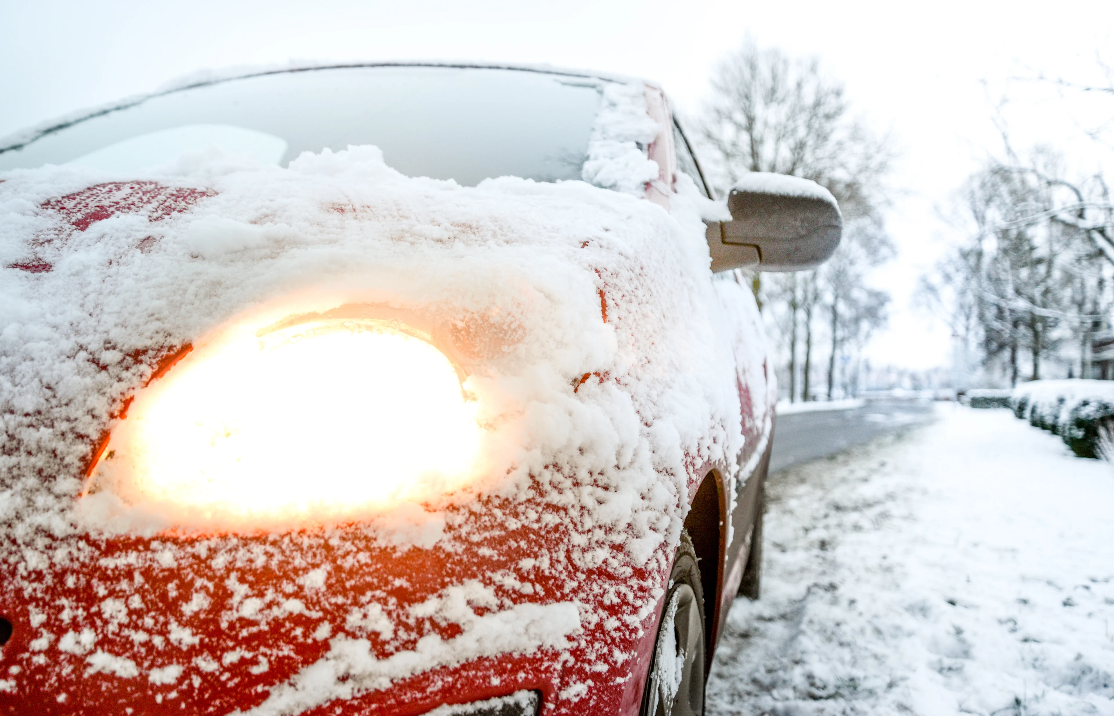 snow-covered-red-sedan-730901