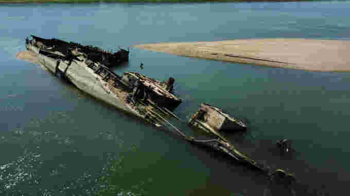 REUTERS: Wreckage of a World War Two German warship is seen in the Danube in Prahovo, Serbia August 18, 2022. REUTERS/Fedja Grulovic