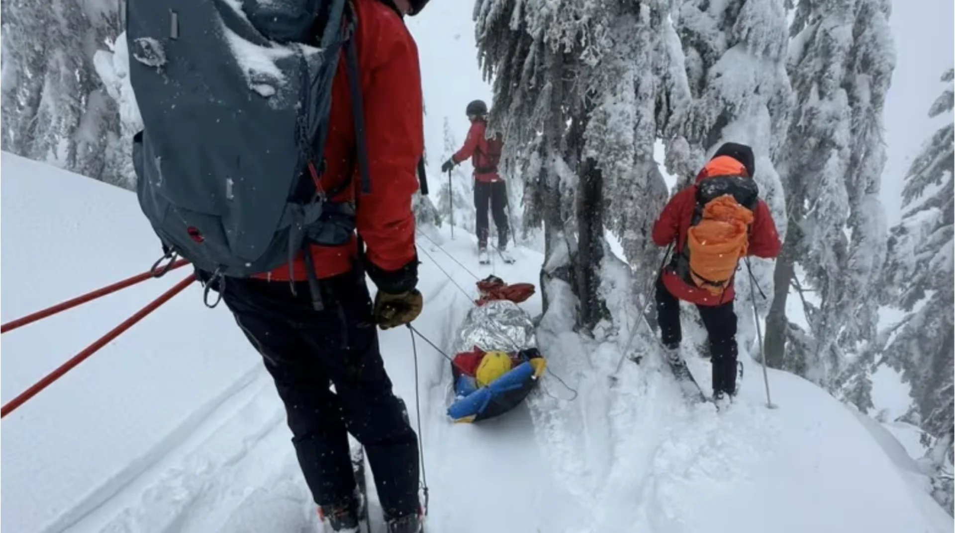 CBC: A North Shore Rescue crew moves the avalanche victim down Mount Seymour on a sled. The woman had been trapped under snow for nearly 20 minutes. (North Shore Rescue)