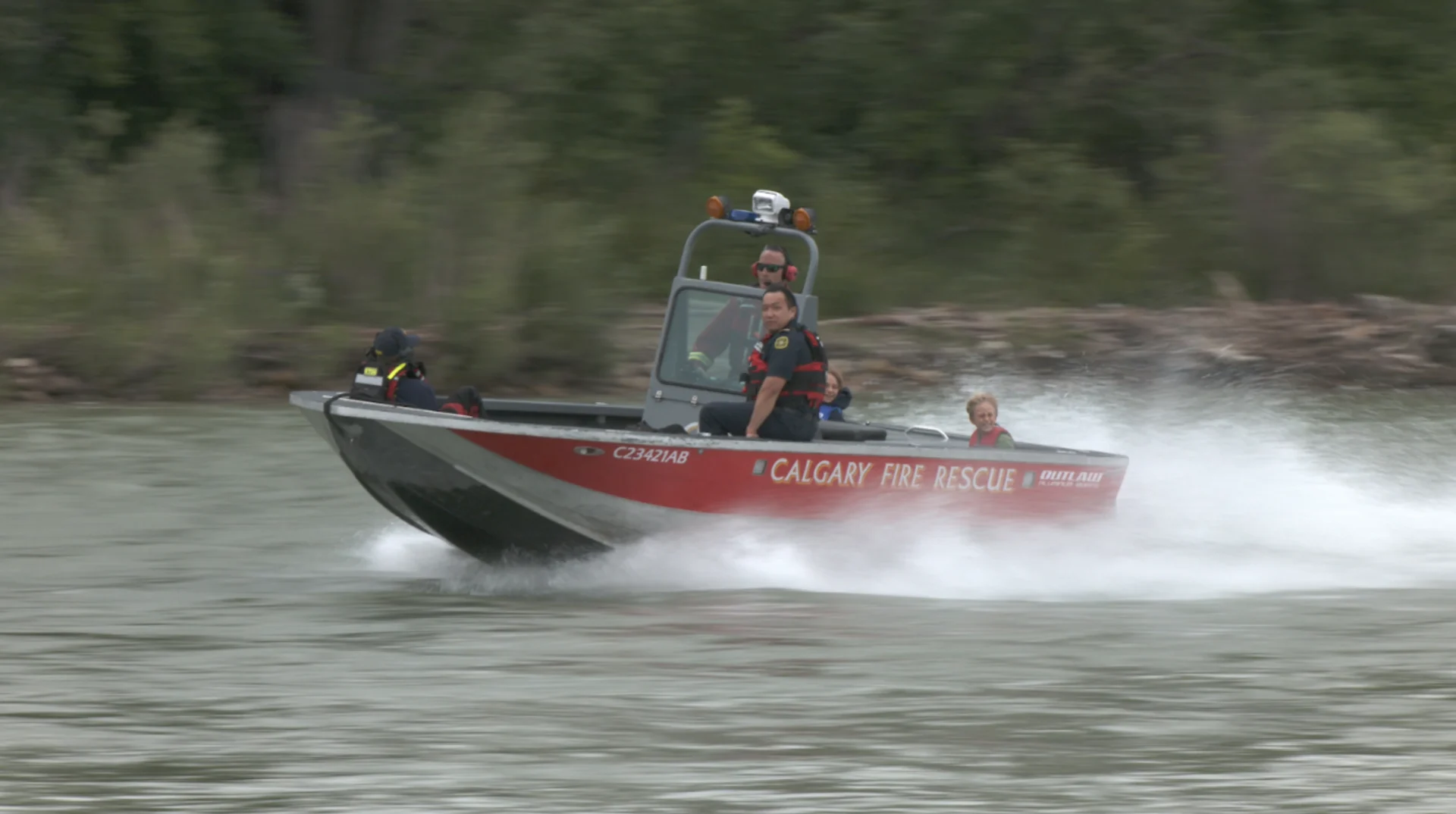 Connor O’Donovan | Members of the Calgary Fire Department’s aquatic rescue team race up the Bow River accompanied by Junior Fire Chief Kyrie Rajic (left) and his brother Keenan. 
