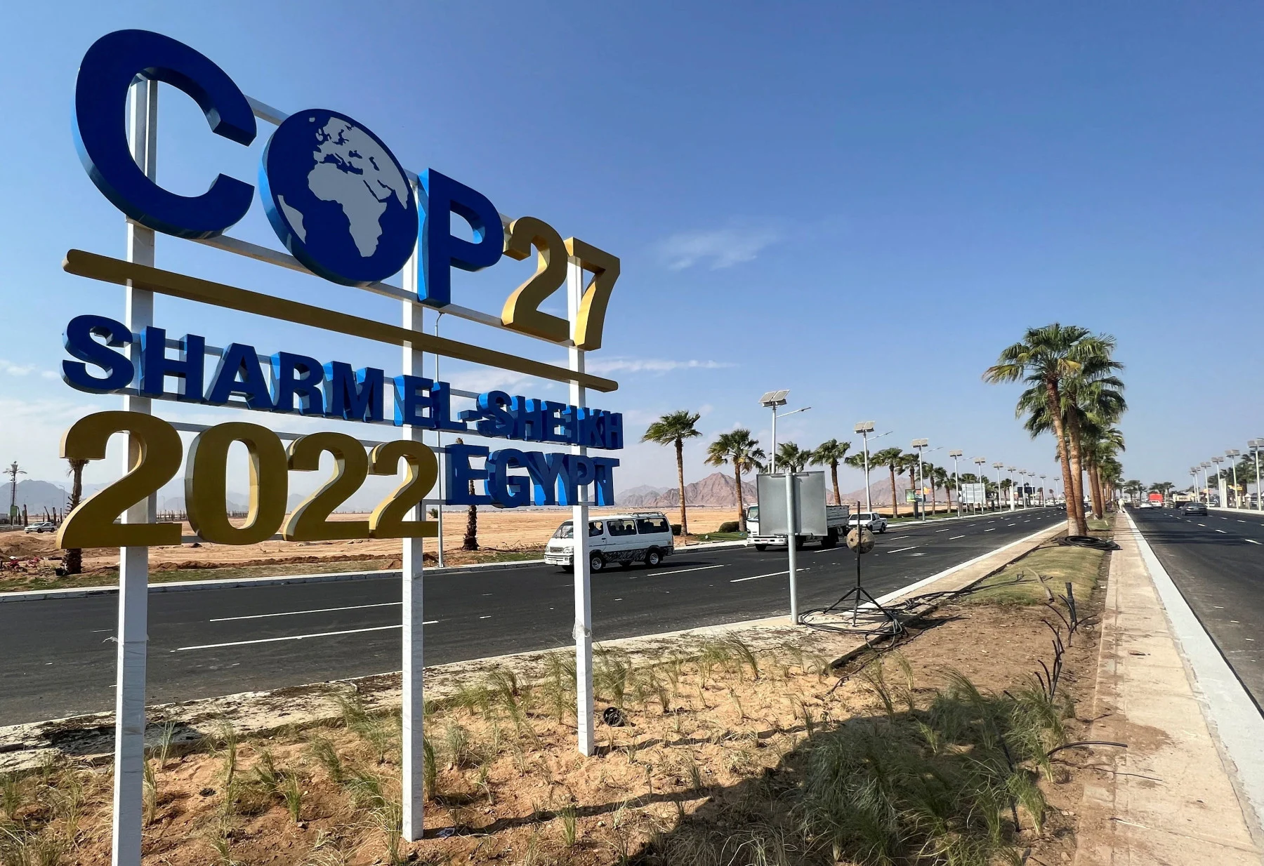 View of a COP27 sign on the road leading to the conference area in Egypt's Red Sea resort of Sharm el-Sheikh town as the city prepares to host the COP27 summit next month, in Sharm el-Sheikh, Egypt October 20, 2022. REUTERS/Sayed Sheasha/File Photo