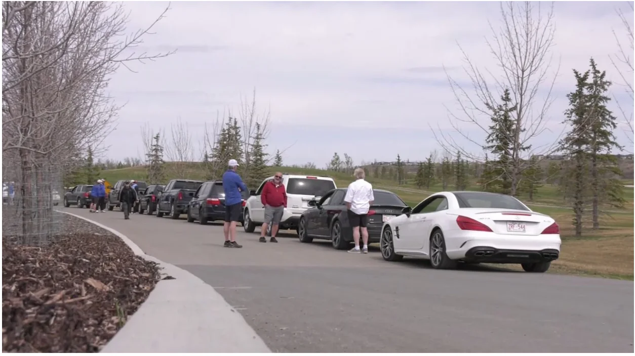 Photo: golfers lined up in Calgary waiting tee time in vehicle. Kyle Brittain