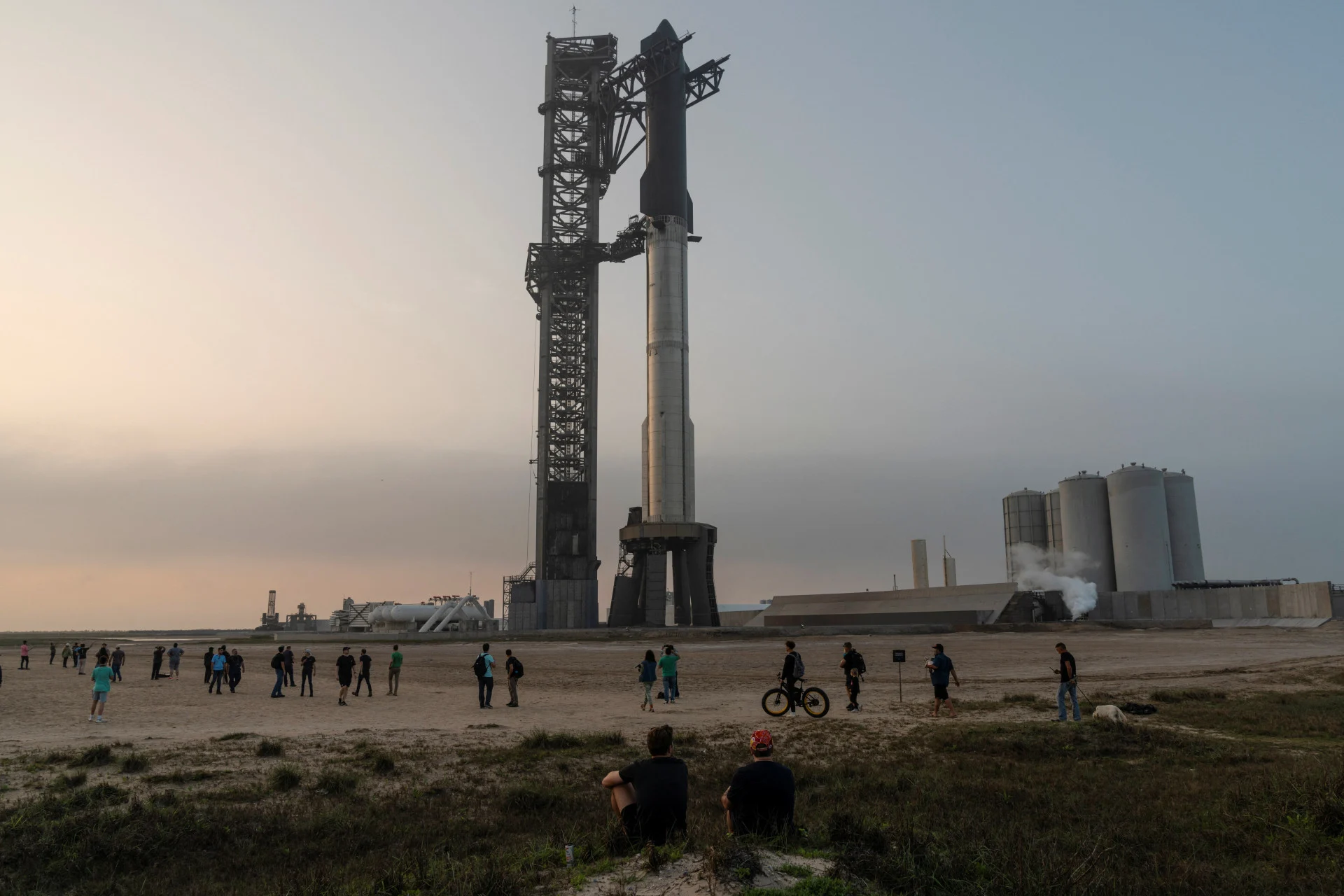 Reuters: Spectators gather as SpaceX's next-generation Starship spacecraft atop its powerful Super Heavy rocket is prepared for a third launch from the company's Boca Chica launchpad on an uncrewed test flight, near Brownsville, Texas, U.S. March 13, 2024. REUTERS/Cheney Orr