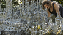 Artist sculpts sprawling castle on dried riverbank amid drought in Europe