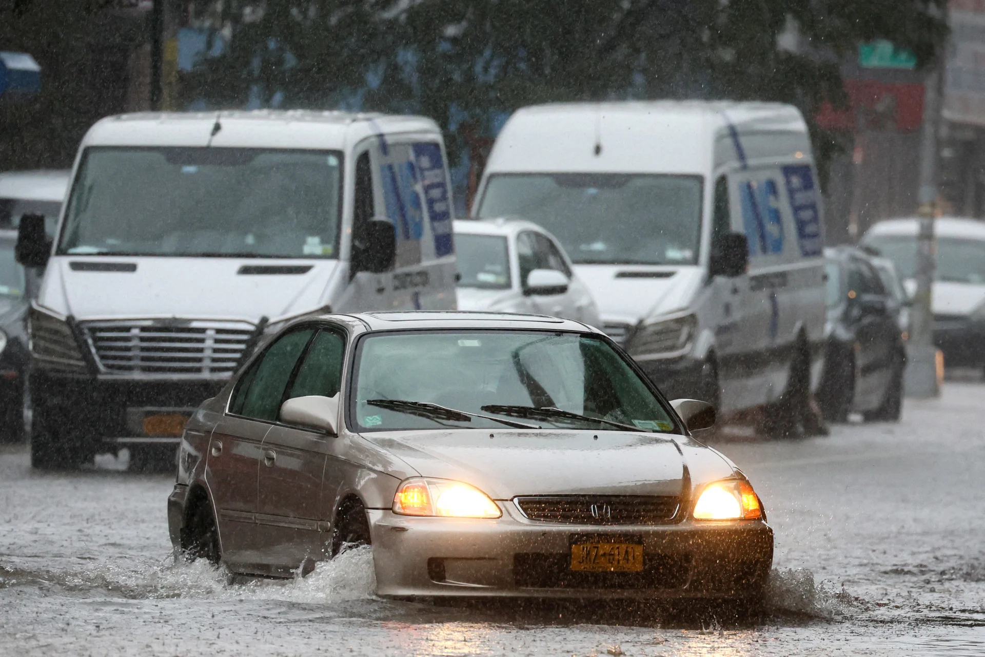 Reuters:  Source: Reuters Traffic is seen on a flooded street, as the remnants of Tropical Storm Ophelia bring flooding across mid-Atlantic and Northeast, in the Brooklyn borough of New York City, U.S., September 29, 2023. REUTERS/Brendan McDermid