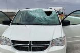 Driver knocked unconscious after ice chunk flies off truck, breaking windshield