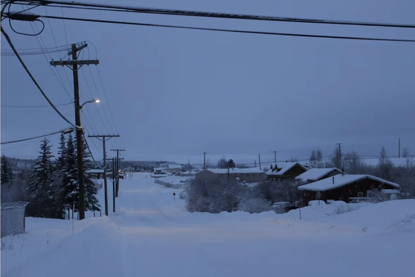 CBC: Distribution lines carry power from a diesel generating plant to homes in Fort Good Hope, N.W.T. on Jan. 10, 2023. (Liny Lamberink/CBC)