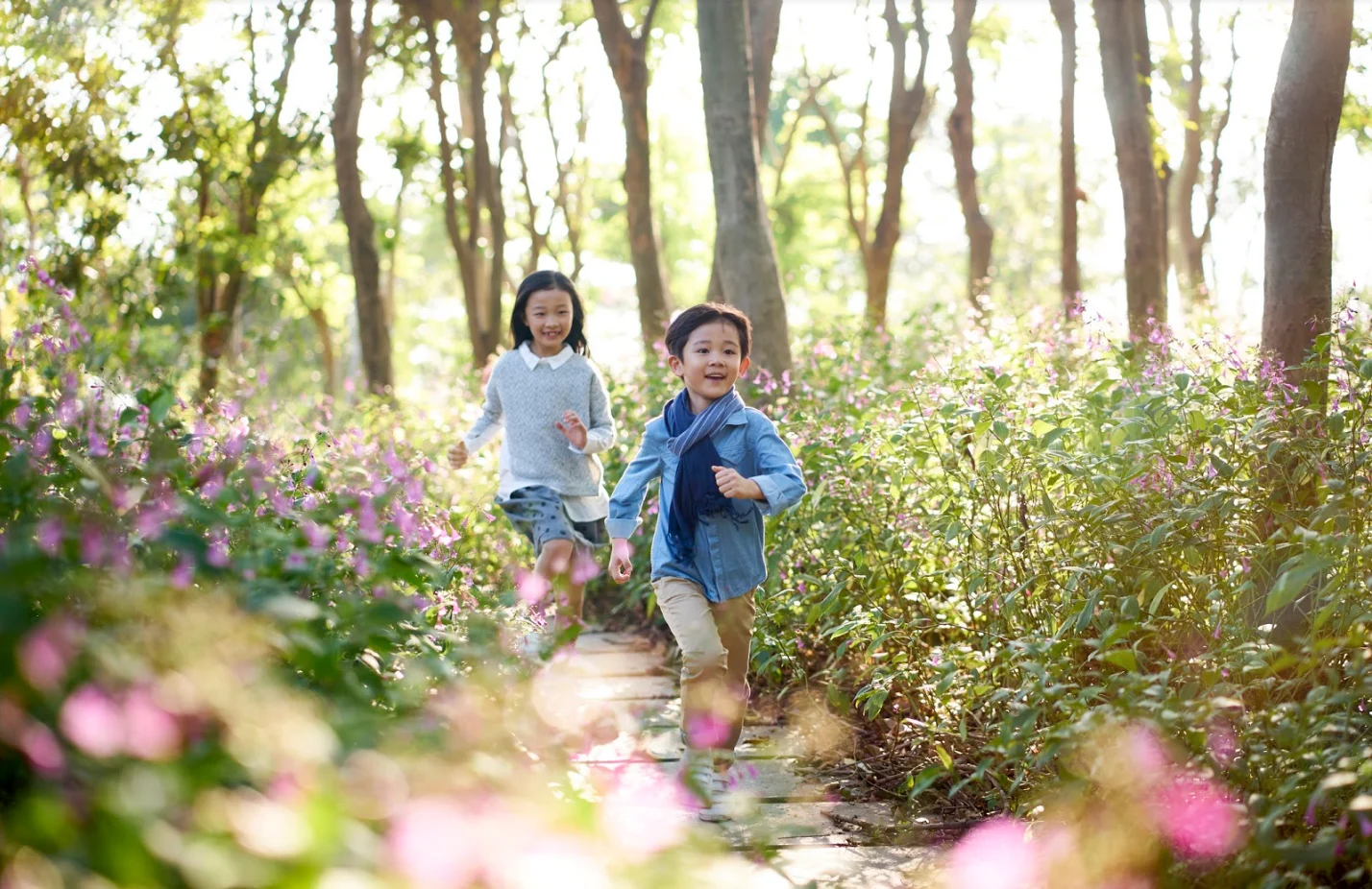 Getty Images: Children running in flower field, spring, summer, sunshine, sun