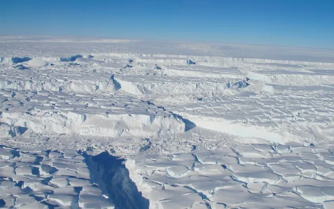 Crevassed ice seen on the transit crossing of the Thwaites Ice Shelf seen from the IceBridge DC-8 on Oct. 16, 2012. (NASA/ J. Yungel)