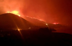 California wildfire triggers evacuations, closes highway