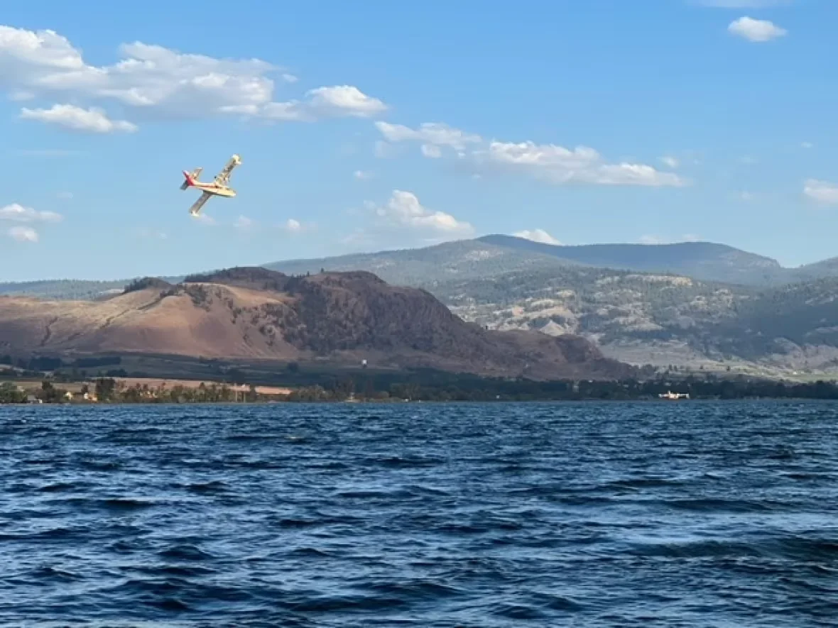 (CBC) Planes scooping water Osoyoos Lake July 30 2023